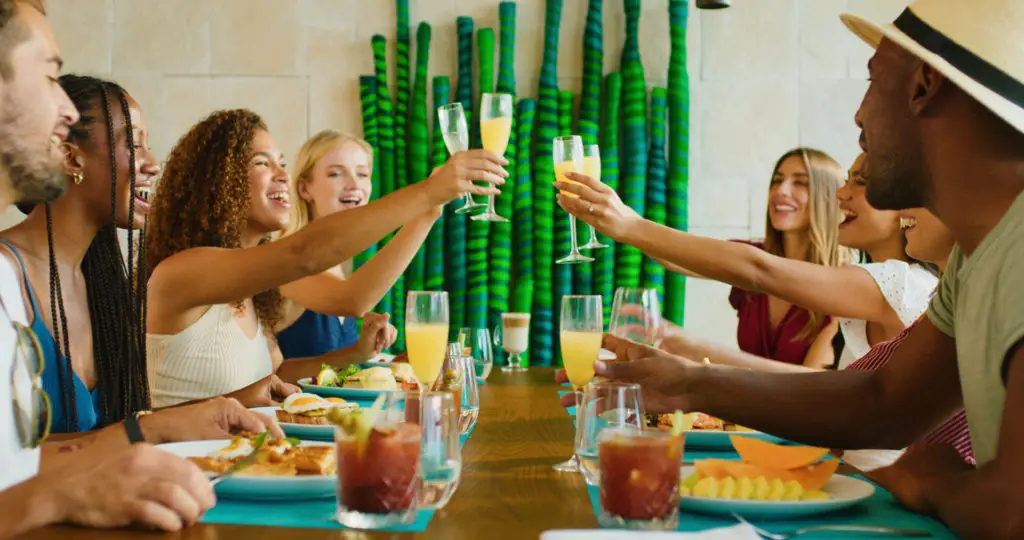 People toasting at a resort restaurant