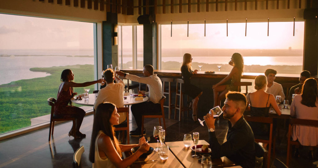 People smiling at a resort dinner