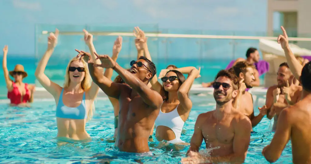 People dancing in a resort pool