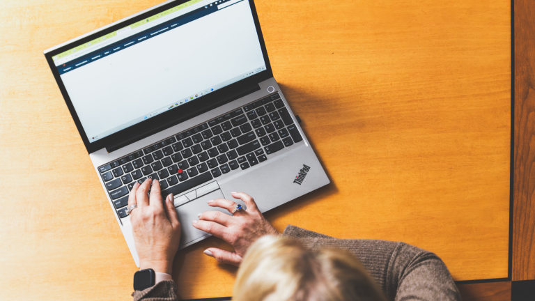 Person typing on computer