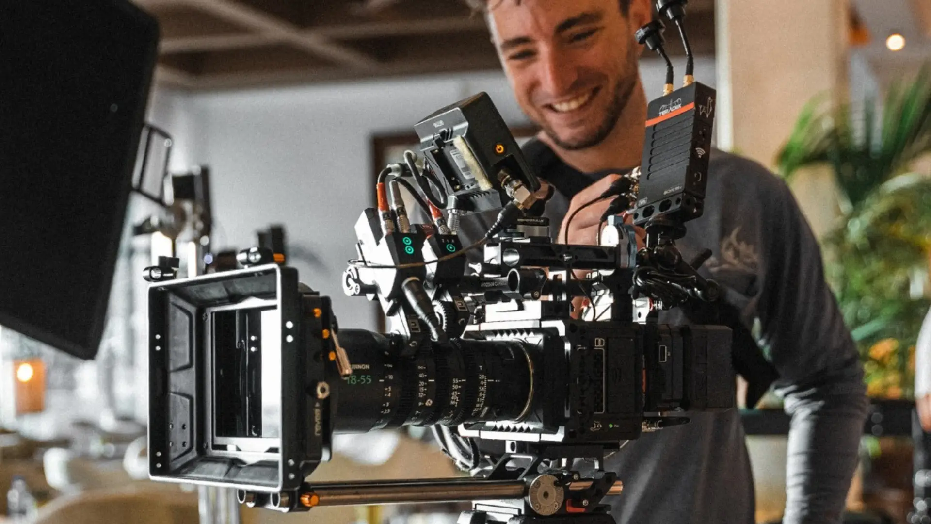 Person using a professional video production camera