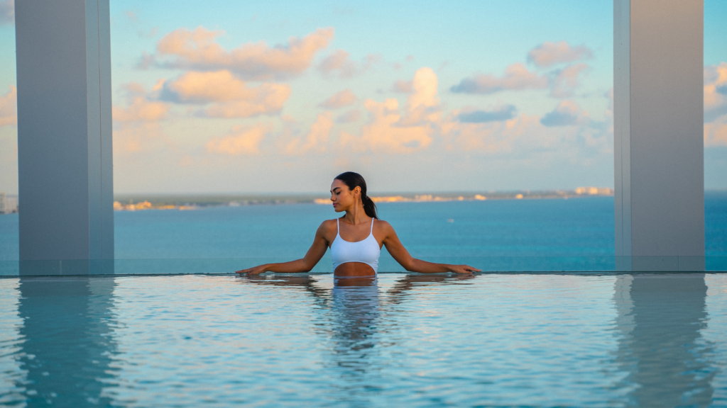 Woman in a pool at a resort