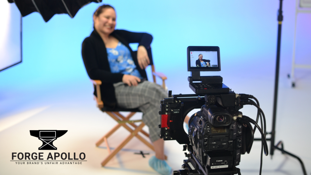 Video camera pointed at someone sitting in a chair