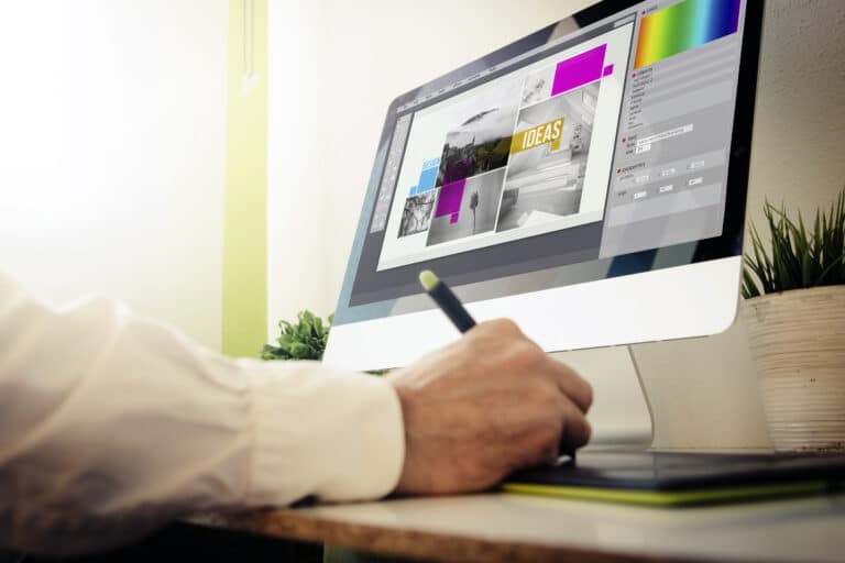 Graphic designer creating a design on their computer