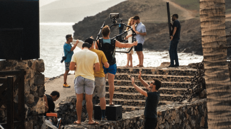 Video crew filming at a resort in Spain