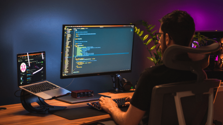 Website developer coding a website on his screen
