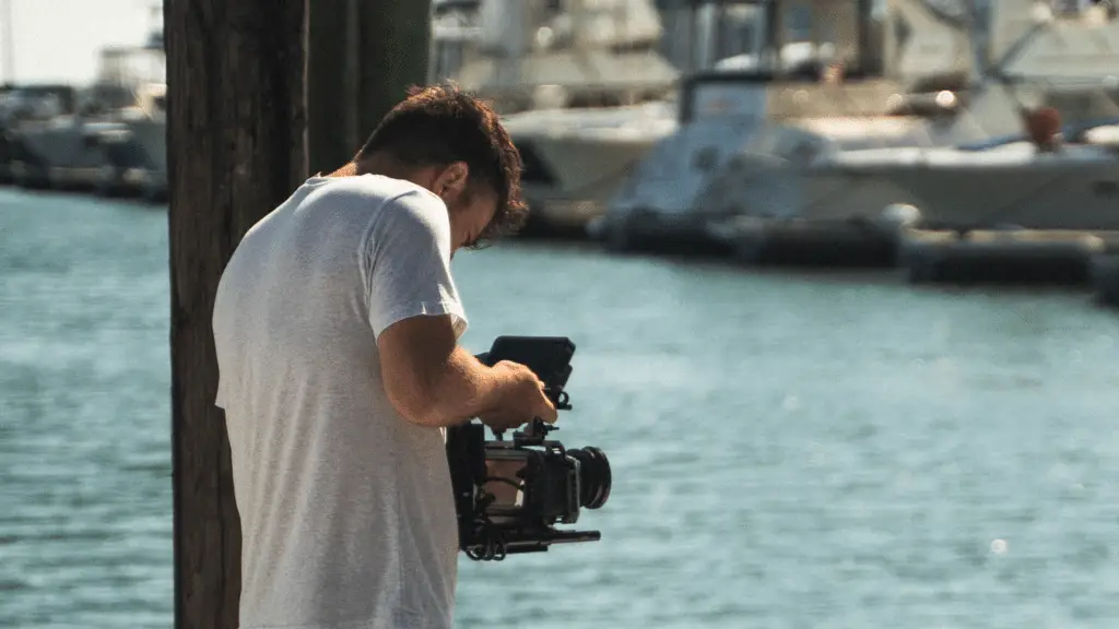 Videographer holding a video camera