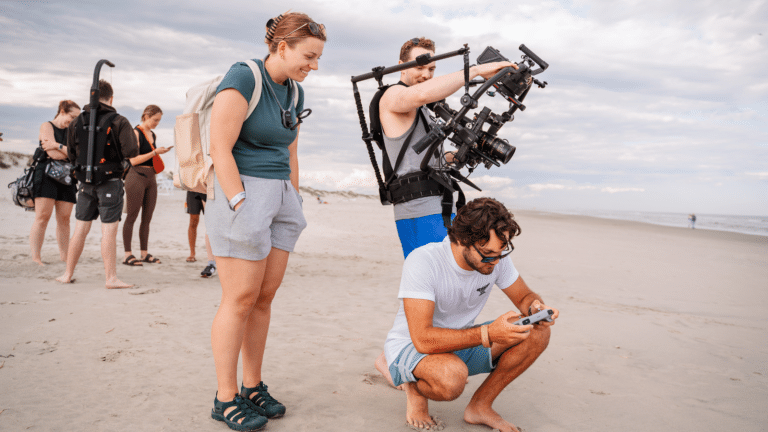 Digital marketing team creating content on the beach