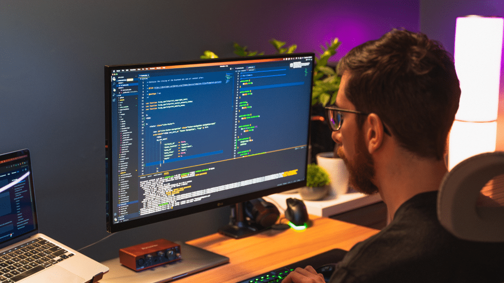 Website developer looking at a computer