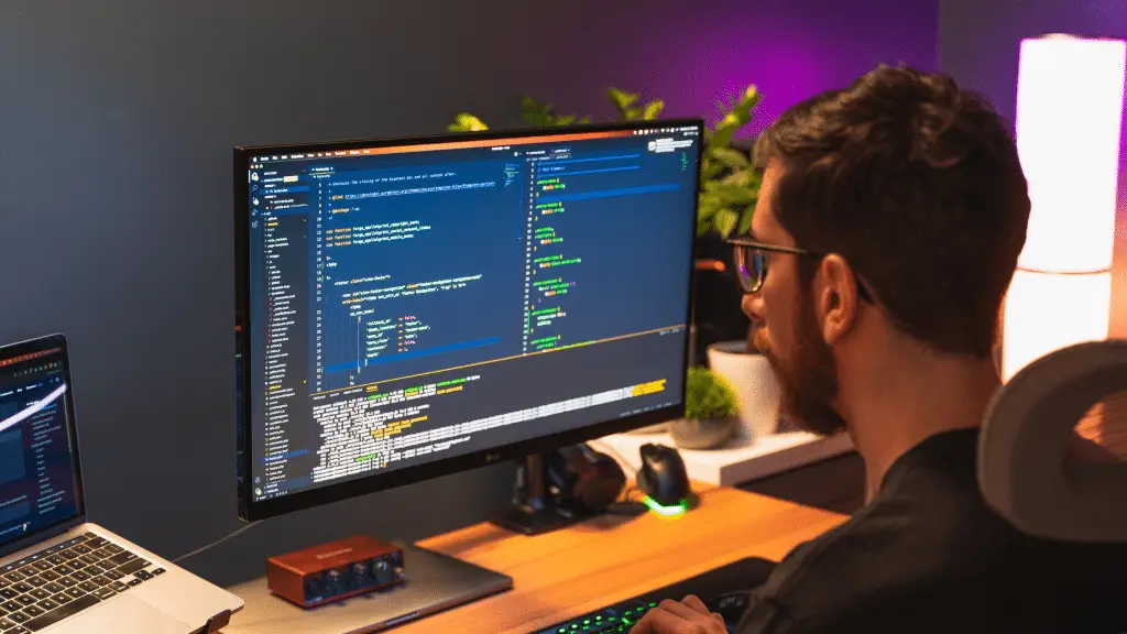Website developer looking at a computer