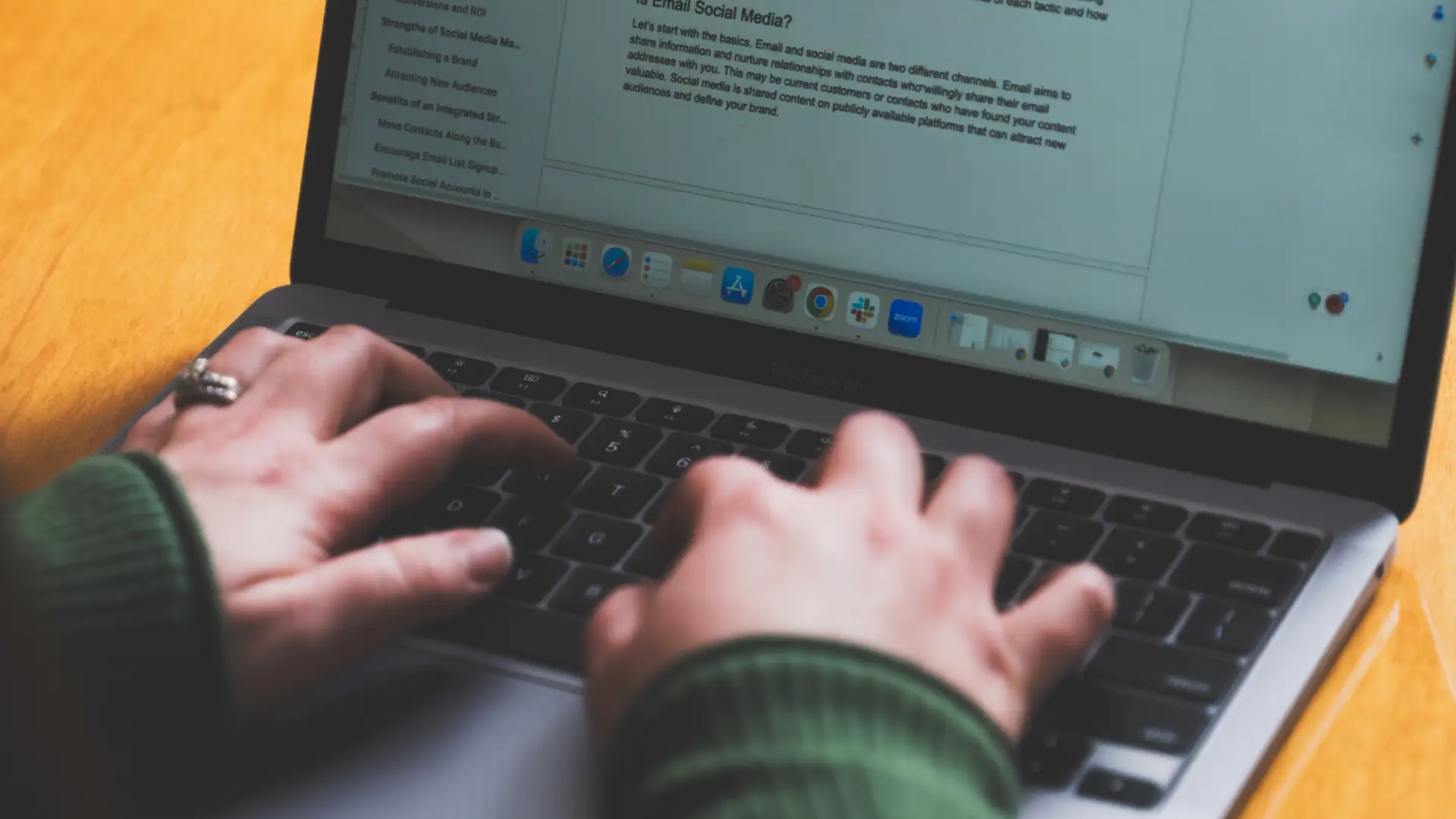 Hotel content writer typing hotel copy on a laptop