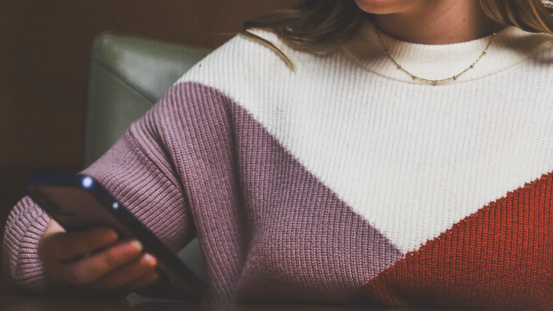 Closeup of a person scrolling through social media on their phone